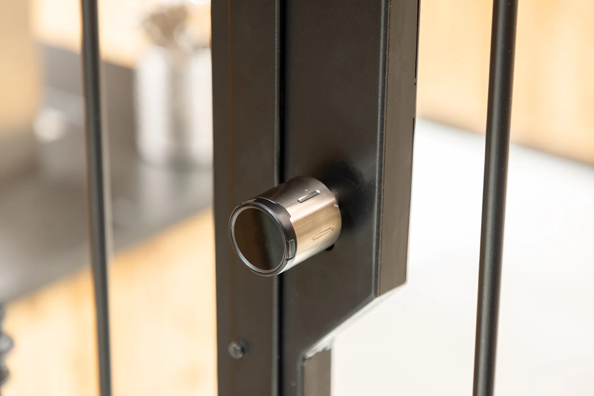 Modern metal door handle with sleek design.